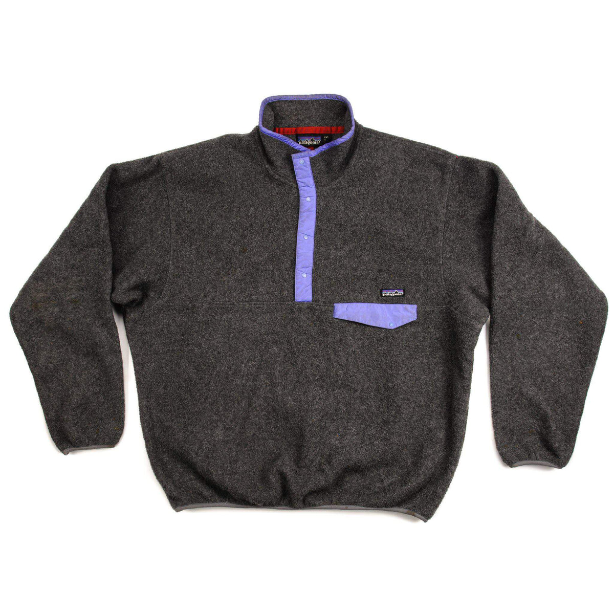 Front view of dark gray Patagonia Snap-T fleece pullover with purple trim