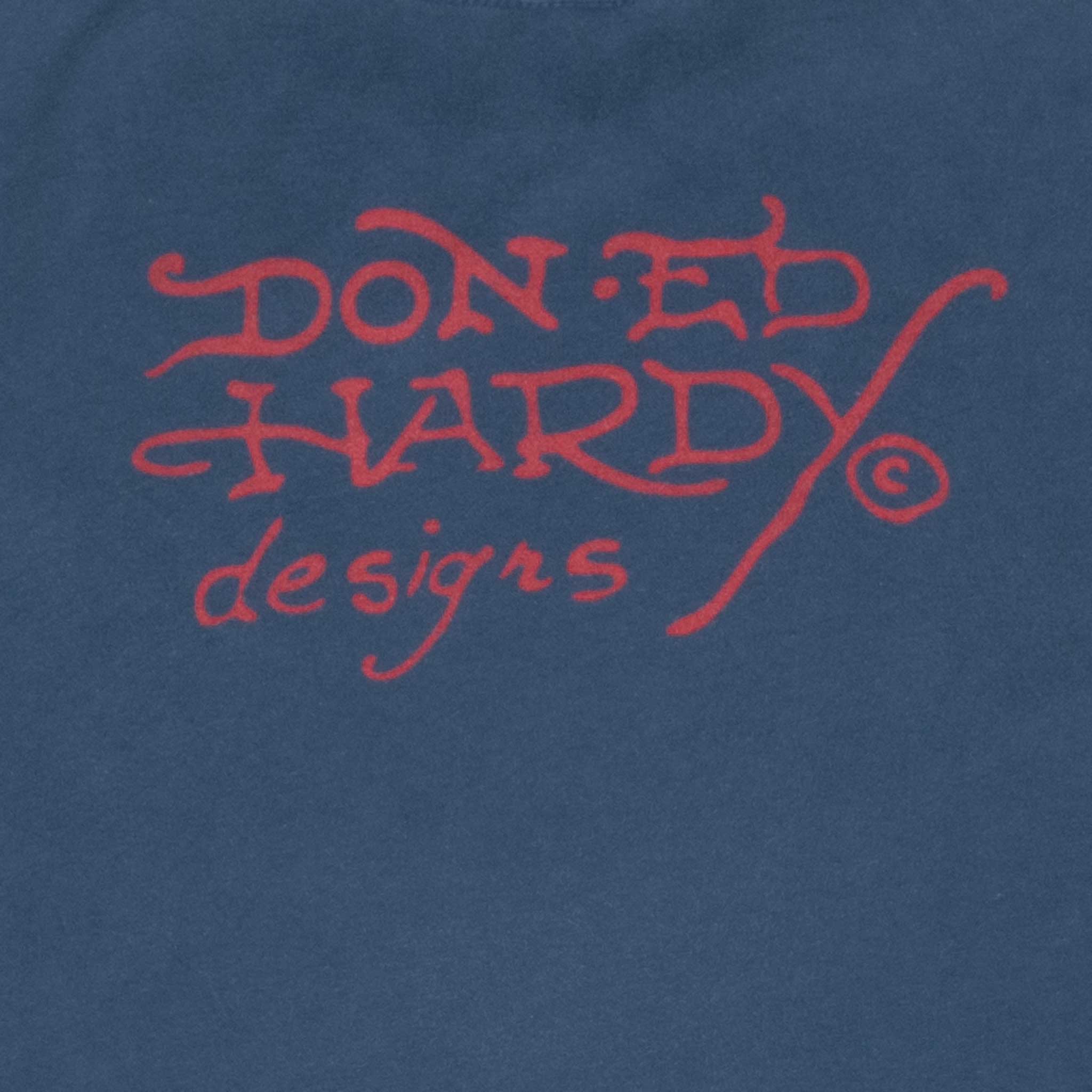 Close-up of red Don Ed Hardy Designs back print