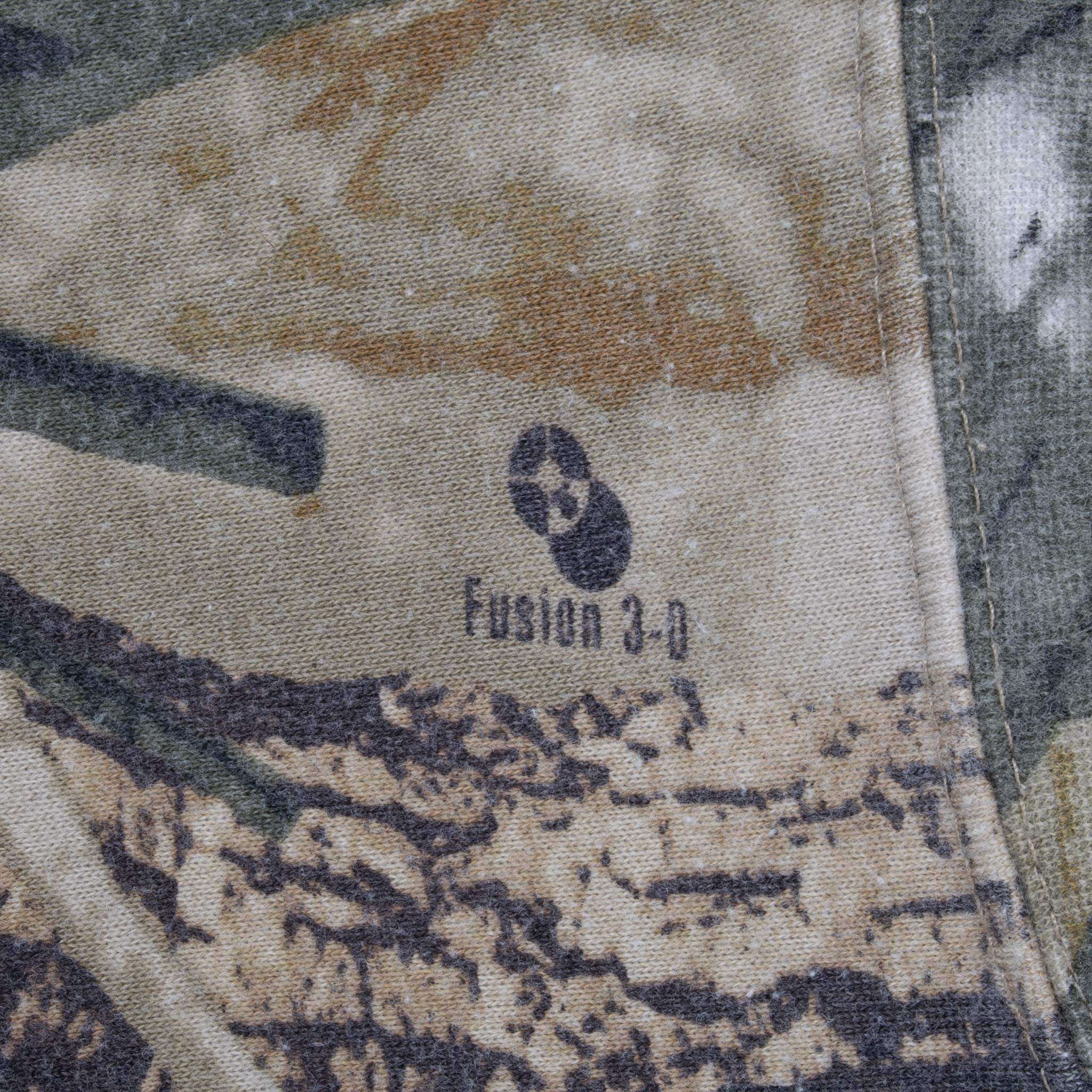 Fusion 3-D logo printed within the tan and gray camouflage pattern