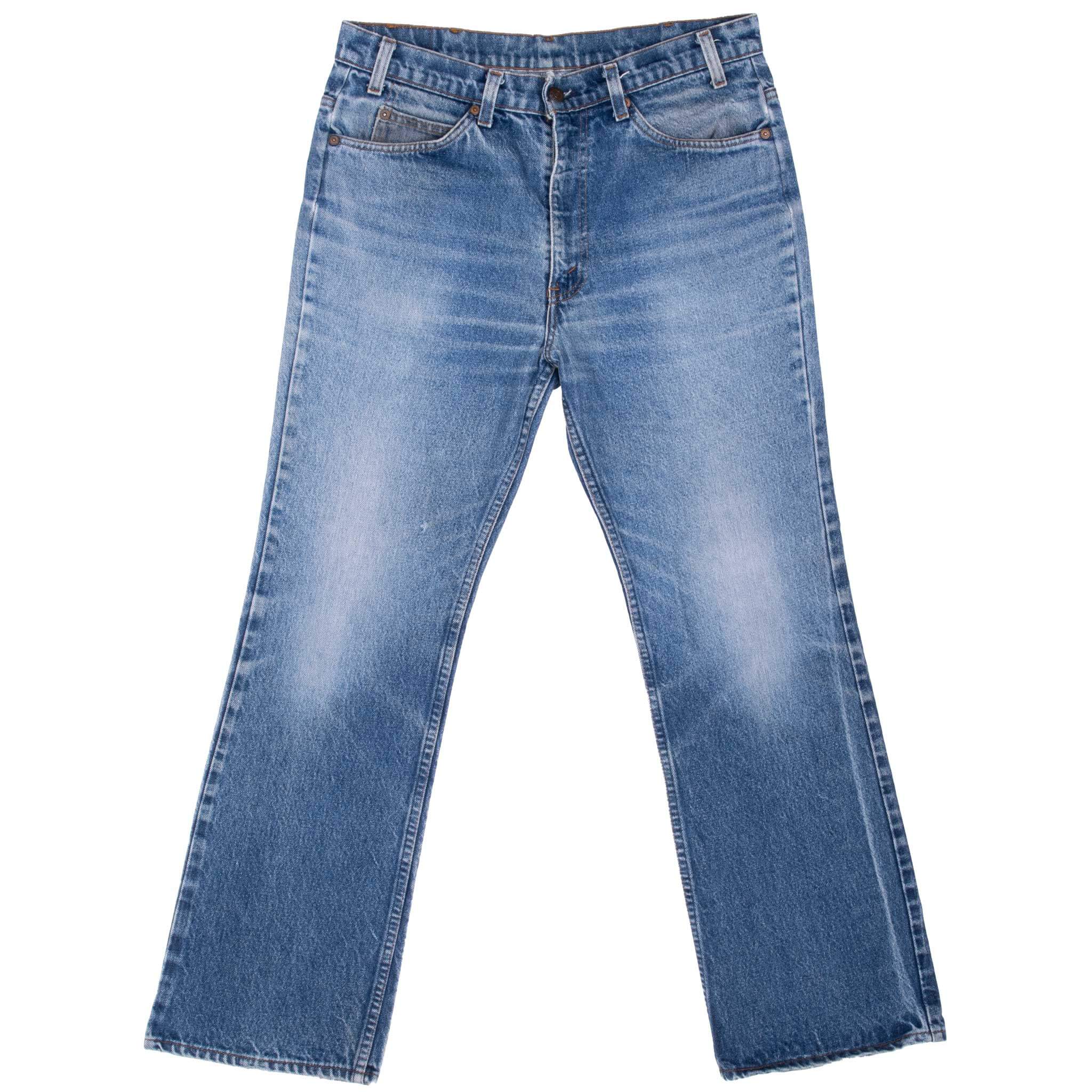 Vintage Levis 517 Orange Tab Indigo Jeans Boot Cut Size 32X30 Made In Usa With Medium Light Wash and Beautiful Whiskers early 80s
Size on tag 34X32 actual Size Is 32X30
Back Button #585