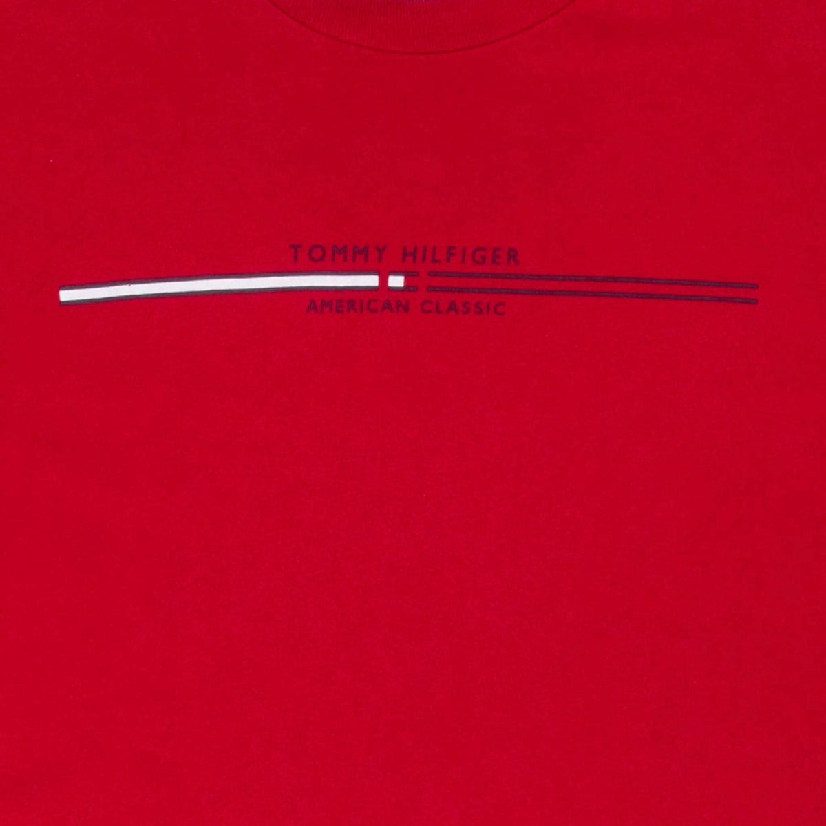 Close-up of Tommy Hilfiger American Classic chest print on red T-shirt