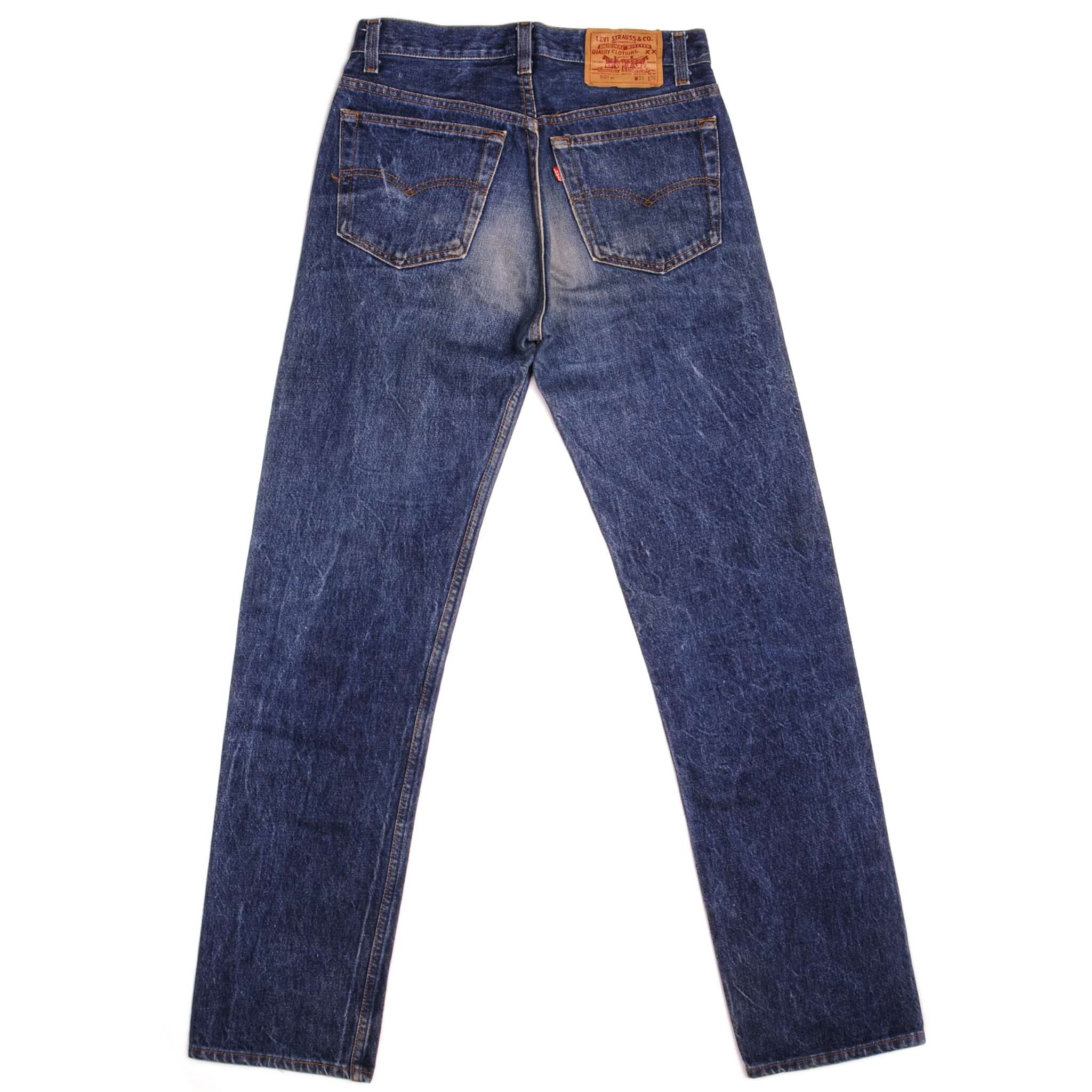 Beautiful Indigo Levis 501 Jeans 1988-1993 Made in USA with a dark blue wash and some nice whiskers. Size on Tag 31X36 ACTUAL SIZE 30X32 Back Button #552