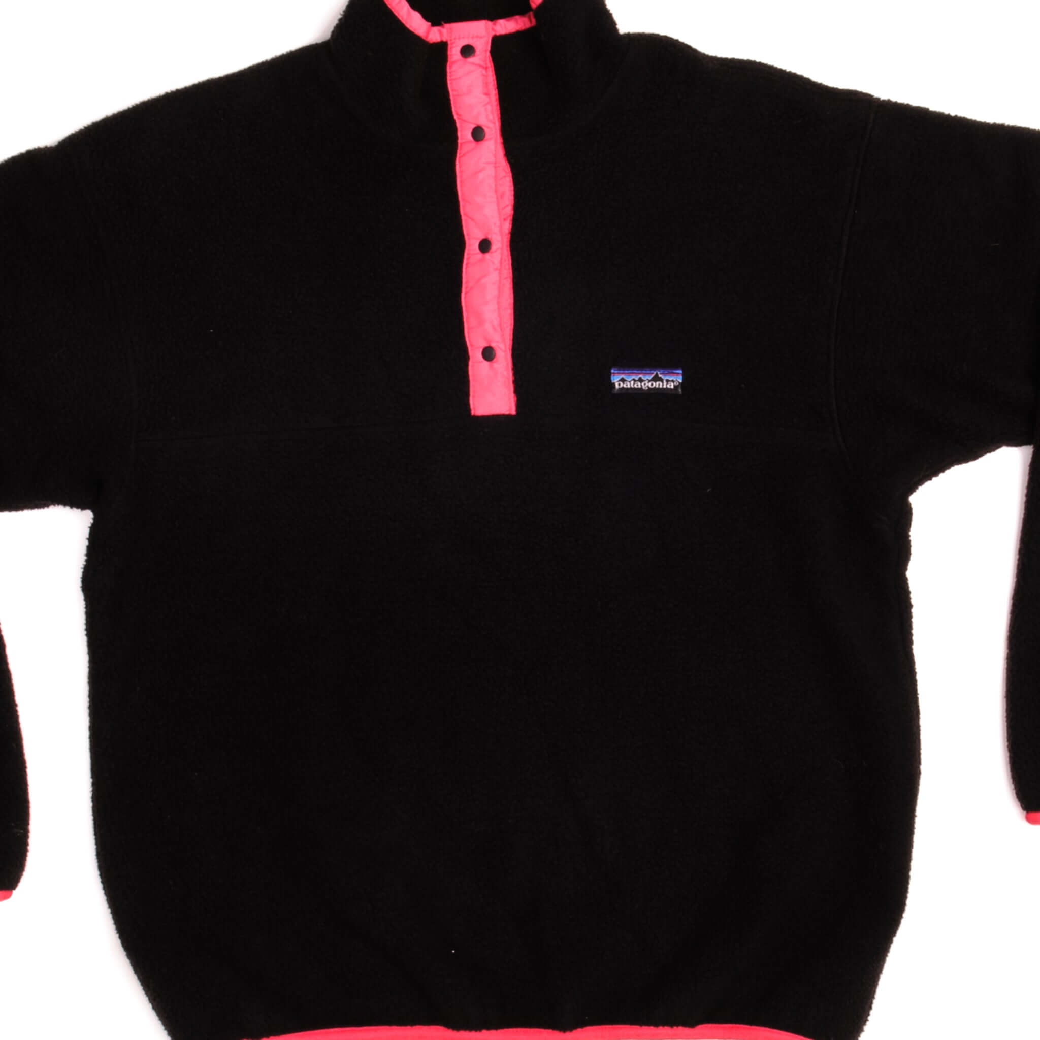 Front of black Patagonia Snap-T fleece pullover with bright pink placket and trim