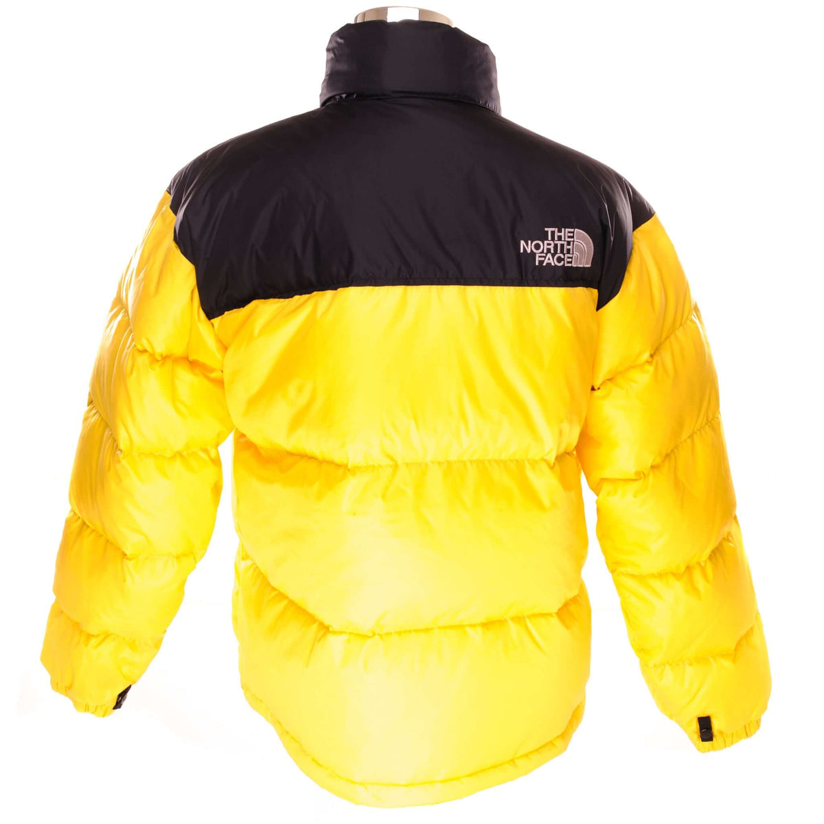 Back of yellow and black The North Face 700 Nuptse down jacket