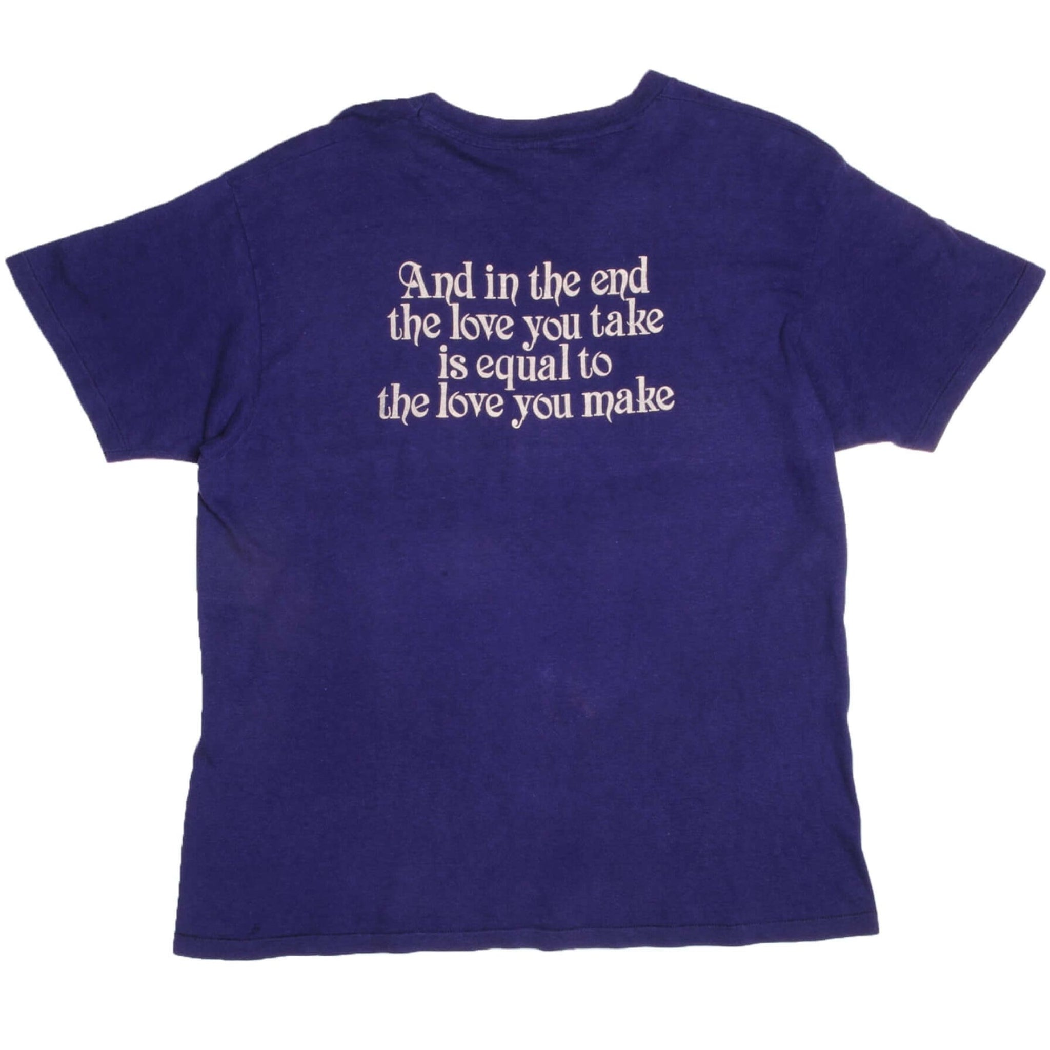 Back of blue John Lennon T-shirt with white “And in the end” lyric print