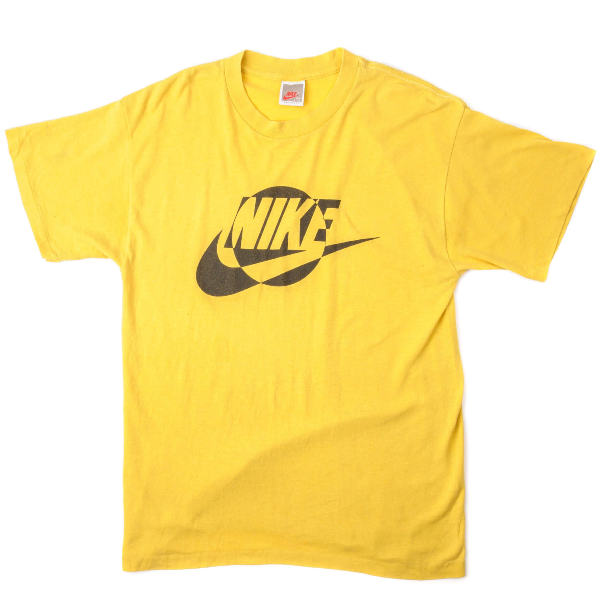 Vintage Nike Tee Shirt from 1987 to 1992 Size Medium Made In USA. yellow
