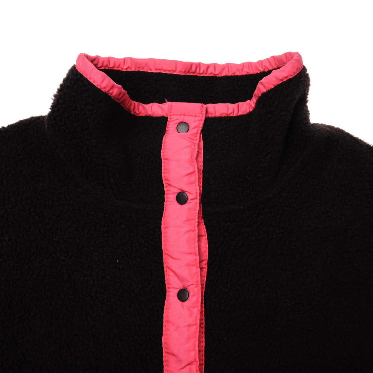 Close-up of bright pink snap placket and stand collar on black Patagonia fleece