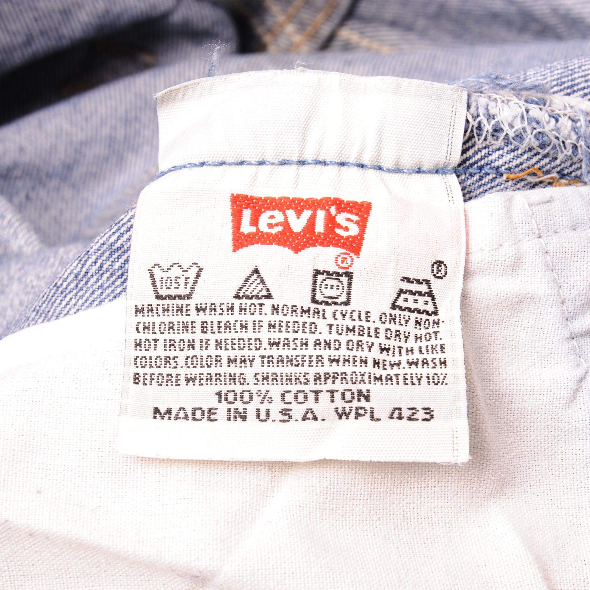 Beautiful Indigo Levis 501 Jeans 1990s Made in USA with a medium blue wash, a nice contrast of light and medium blue and some strong whiskers. Size on Tag 35X38 ACTUAL SIZE 34X34 Back Button #524