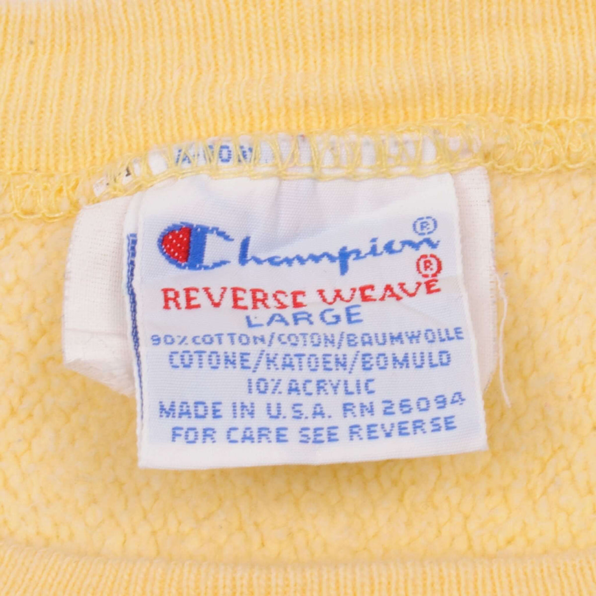 Champion Reverse Weave large neck label inside yellow sweatshirt