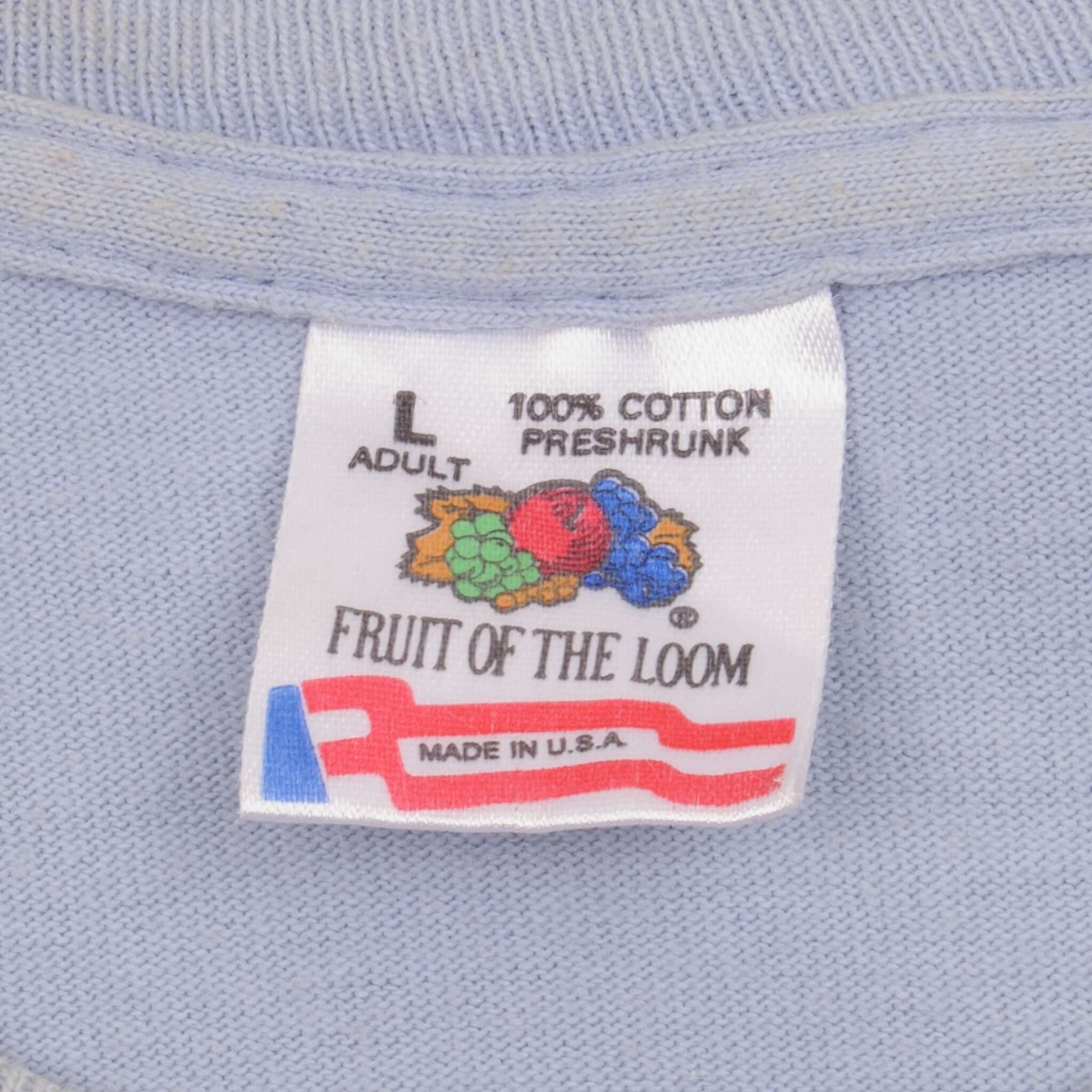 Fruit of the Loom size large neck tag showing 100% cotton, preshrunk, and made in USA