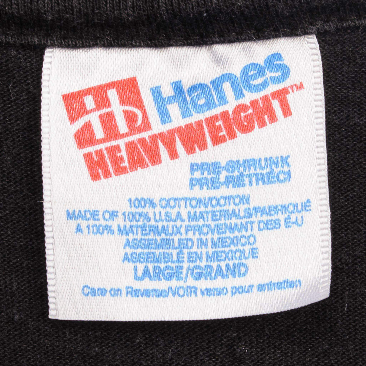 Close-up of Hanes Heavyweight neck label on black Counting Crows T-shirt