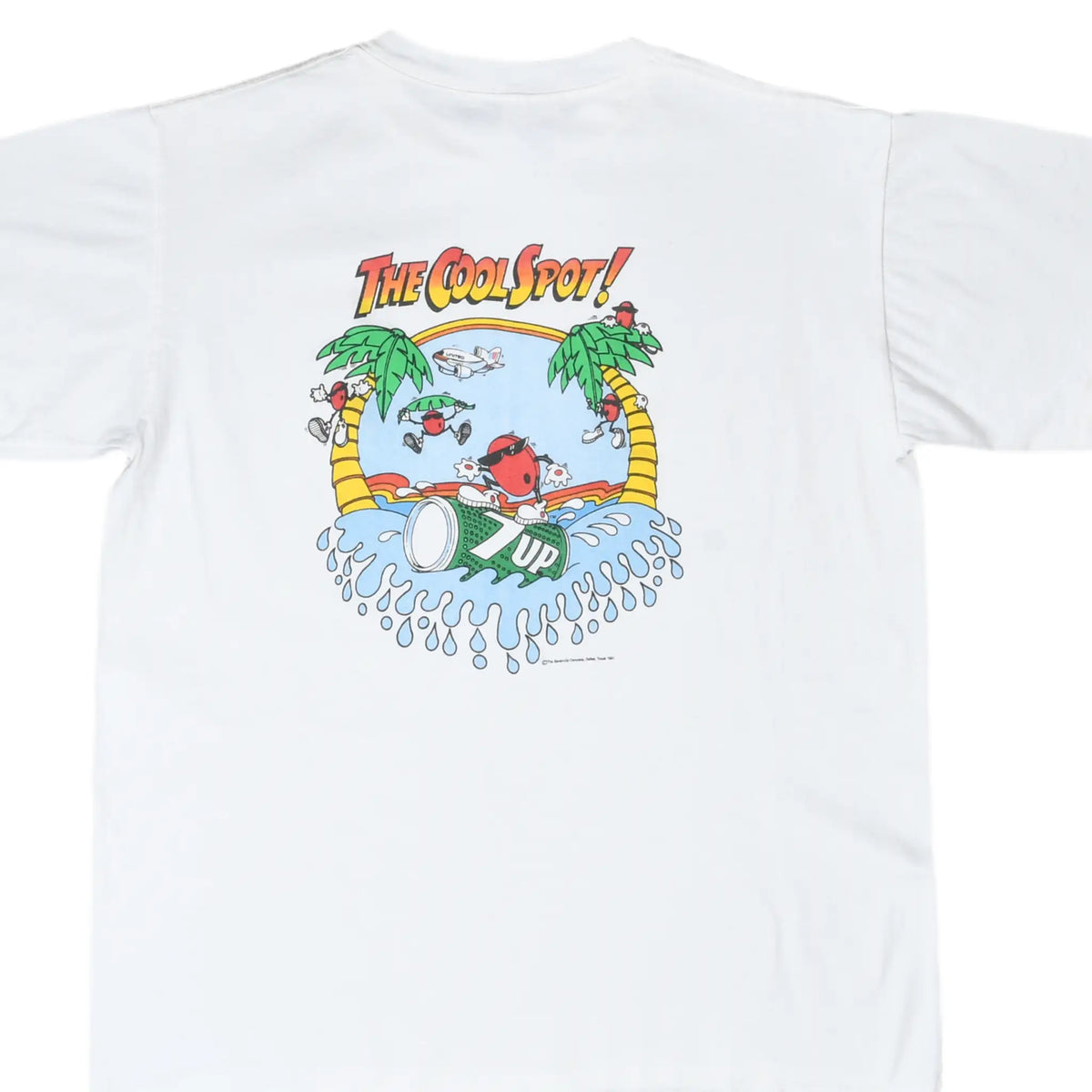 Back of white T-shirt with 7UP Cool Spot surfing graphic, palm trees, splashing waves, and United airplane