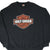 Front of black Harley-Davidson sweatshirt with orange and white bar-and-shield logo