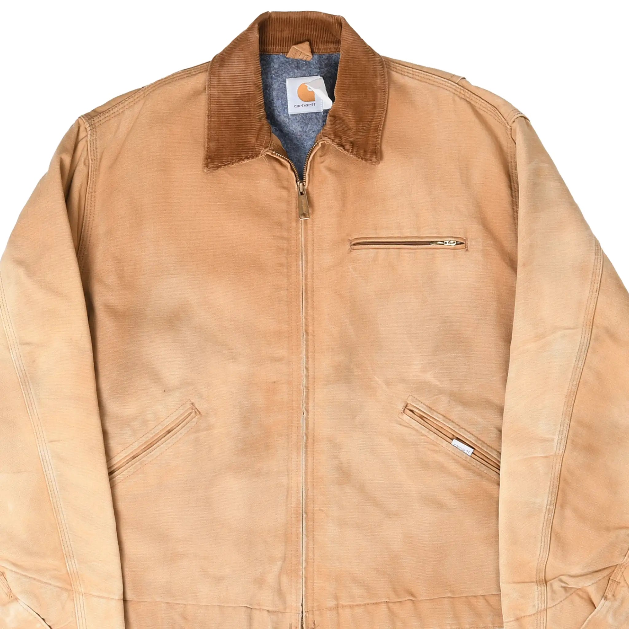 Front detail of brown Carhartt Detroit jacket with corduroy collar and zip pockets