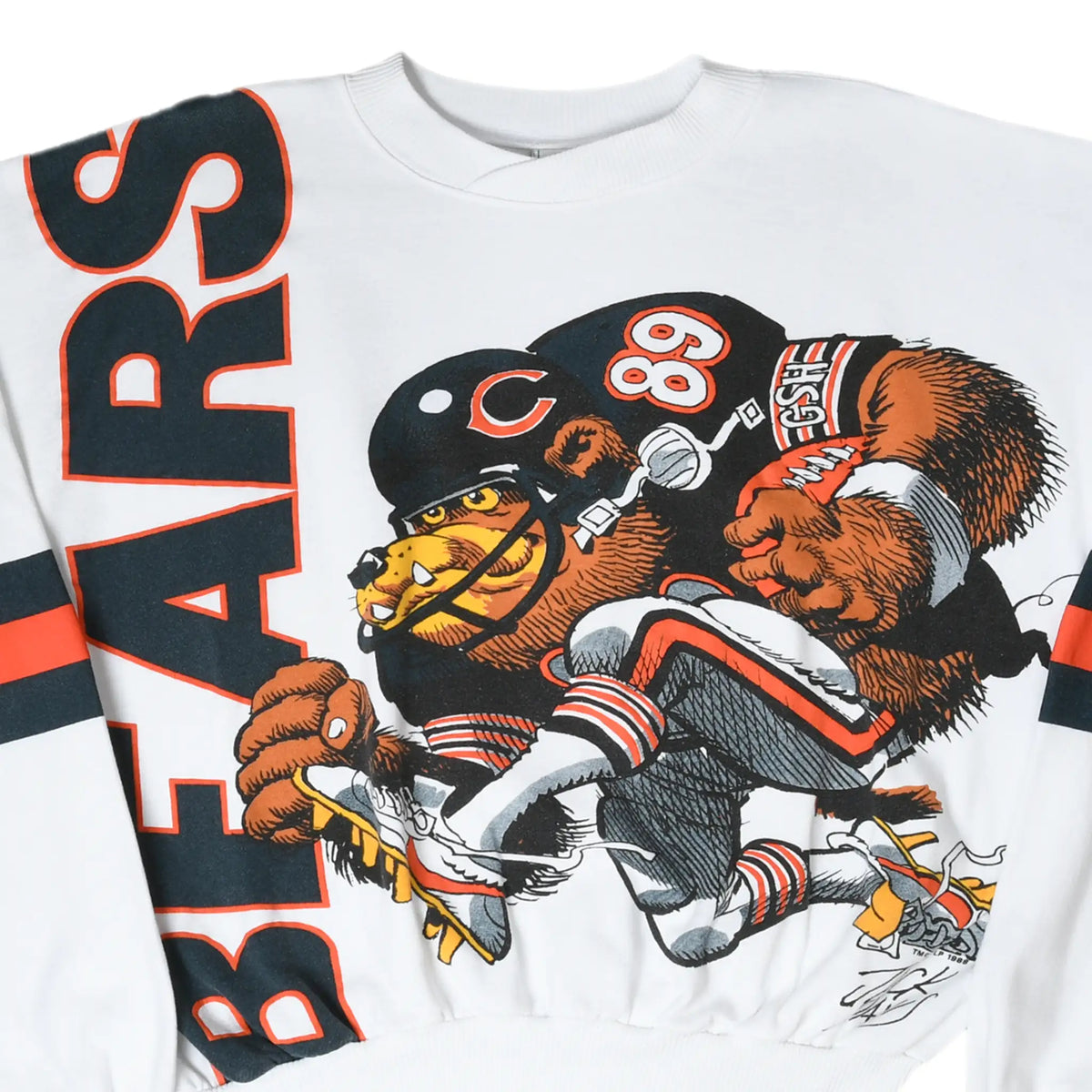 Close-up of white Chicago Bears sweatshirt front with large Bears lettering and football player graphic