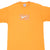 Front upper view of orange Nike T-shirt with white Swoosh and abstract grid graphic
