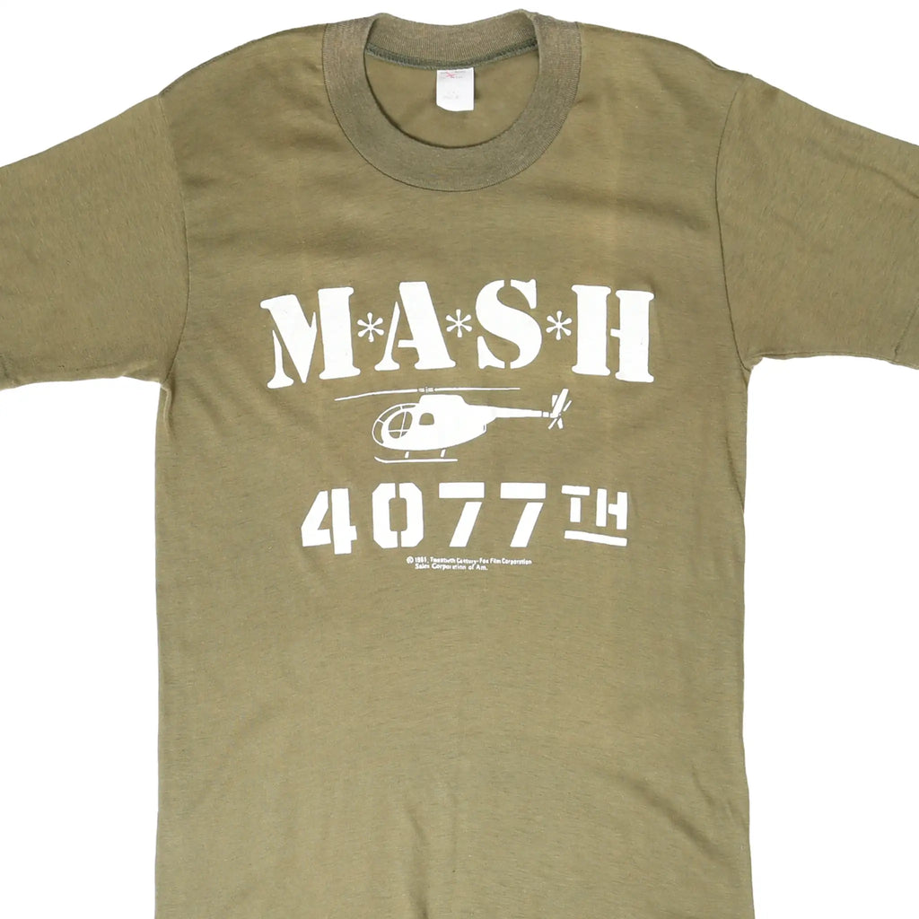 Front of olive green M*A*S*H 4077th T-shirt with white helicopter graphic