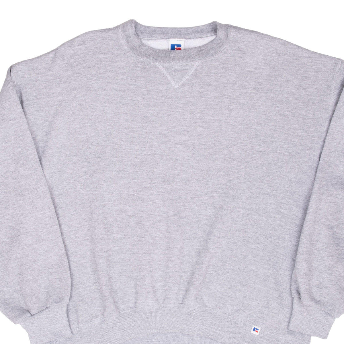 Close front view of a blank gray Russell Athletic crewneck sweatshirt with ribbed trim