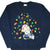 Front of navy Peanuts sweatshirt with Snoopy and Charlie Brown among colorful falling leaves