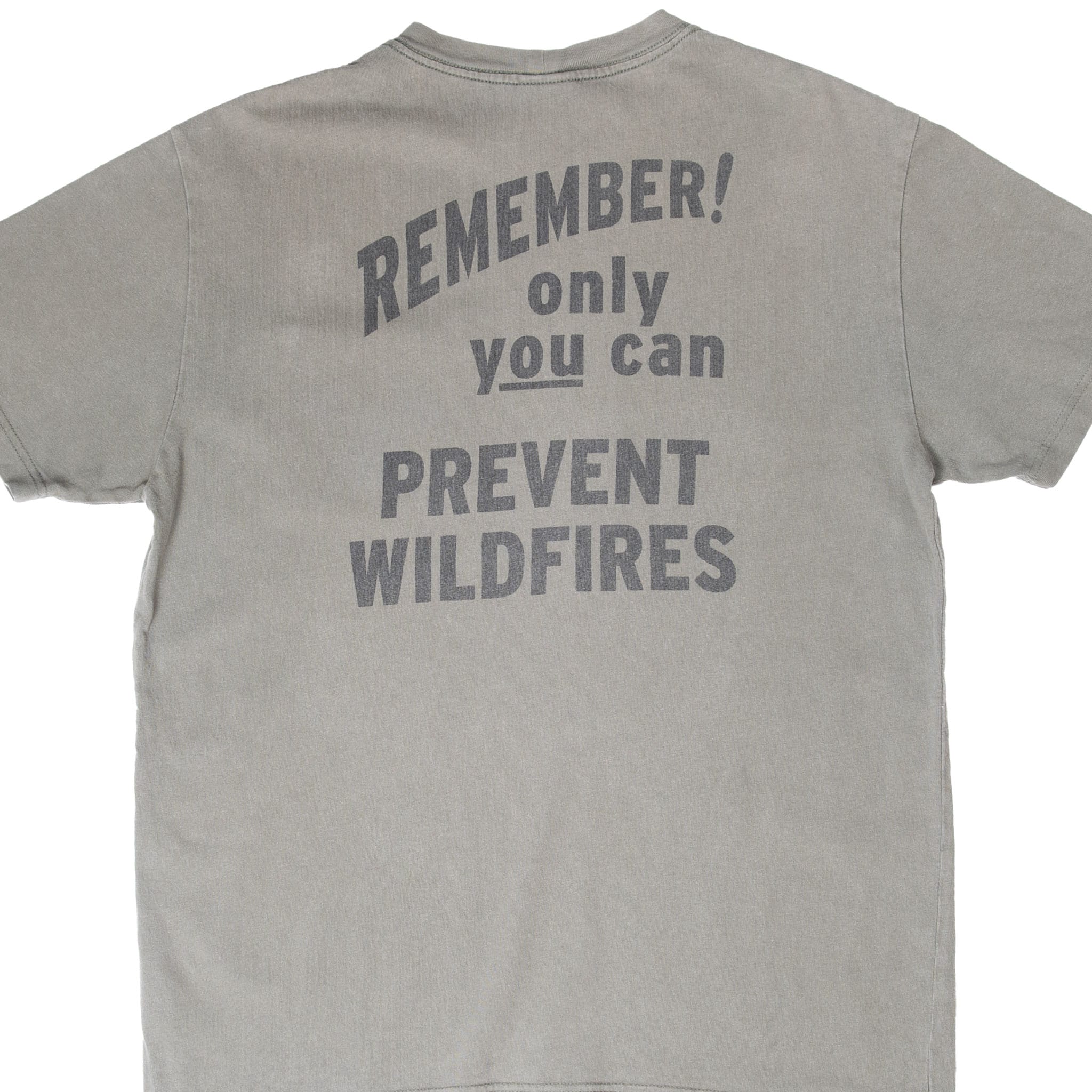 Cropped back of green Filson T-shirt with Only You Can Prevent Wildfires slogan