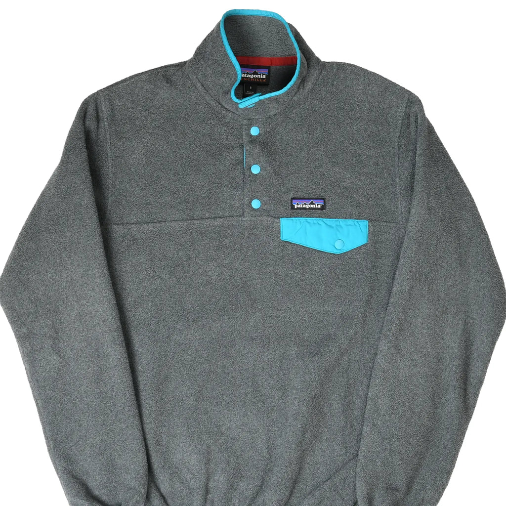 Front of Patagonia dark grey Snap-T Synchilla fleece with turquoise snaps and chest pocket