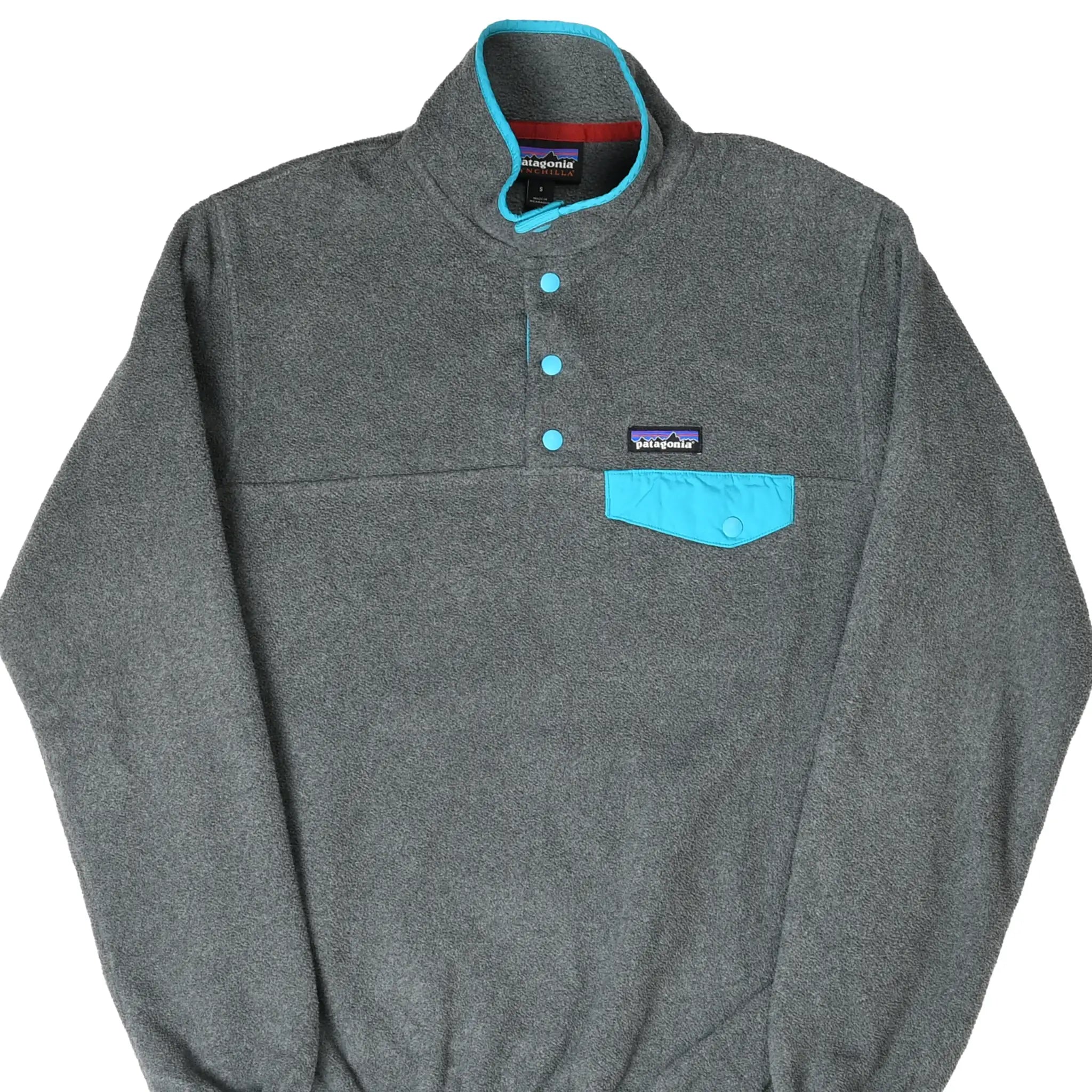 Front of Patagonia dark grey Snap-T Synchilla fleece with turquoise snaps and chest pocket