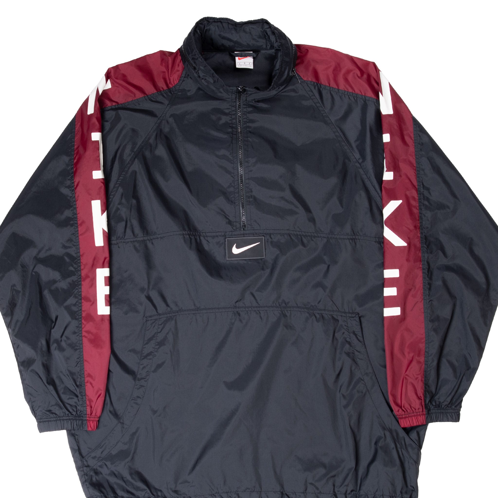 Front of black Nike pullover windbreaker with burgundy panels, white lettering and centered Swoosh