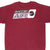 Upper back of burgundy Nike T-shirt with black, white and gray Swoosh Air graphic