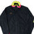 Cropped front of black Columbia Bugaboo jacket with neon green collar lining and pink trim