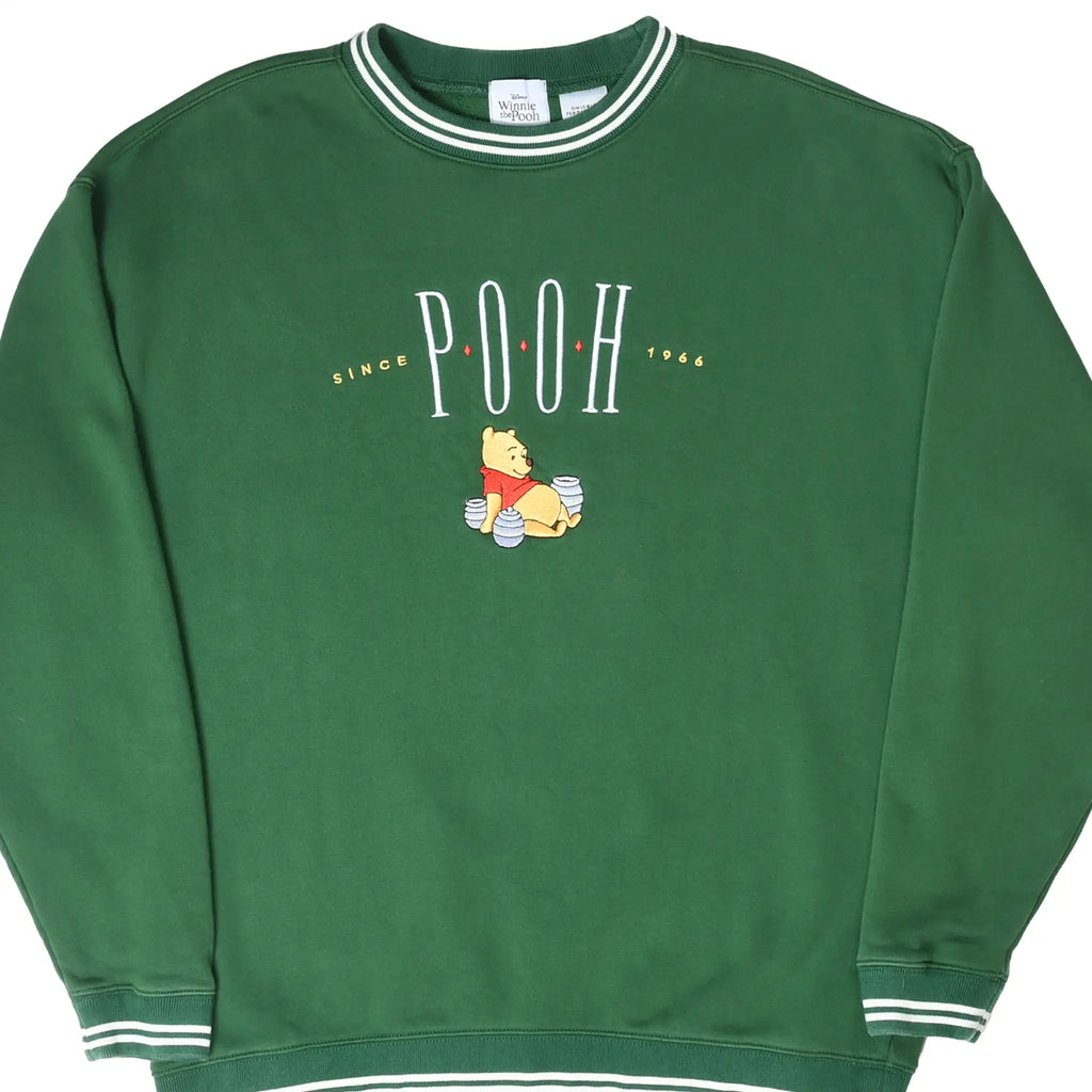 Front of green Disney Winnie the Pooh sweatshirt with striped trim and embroidered chest graphic
