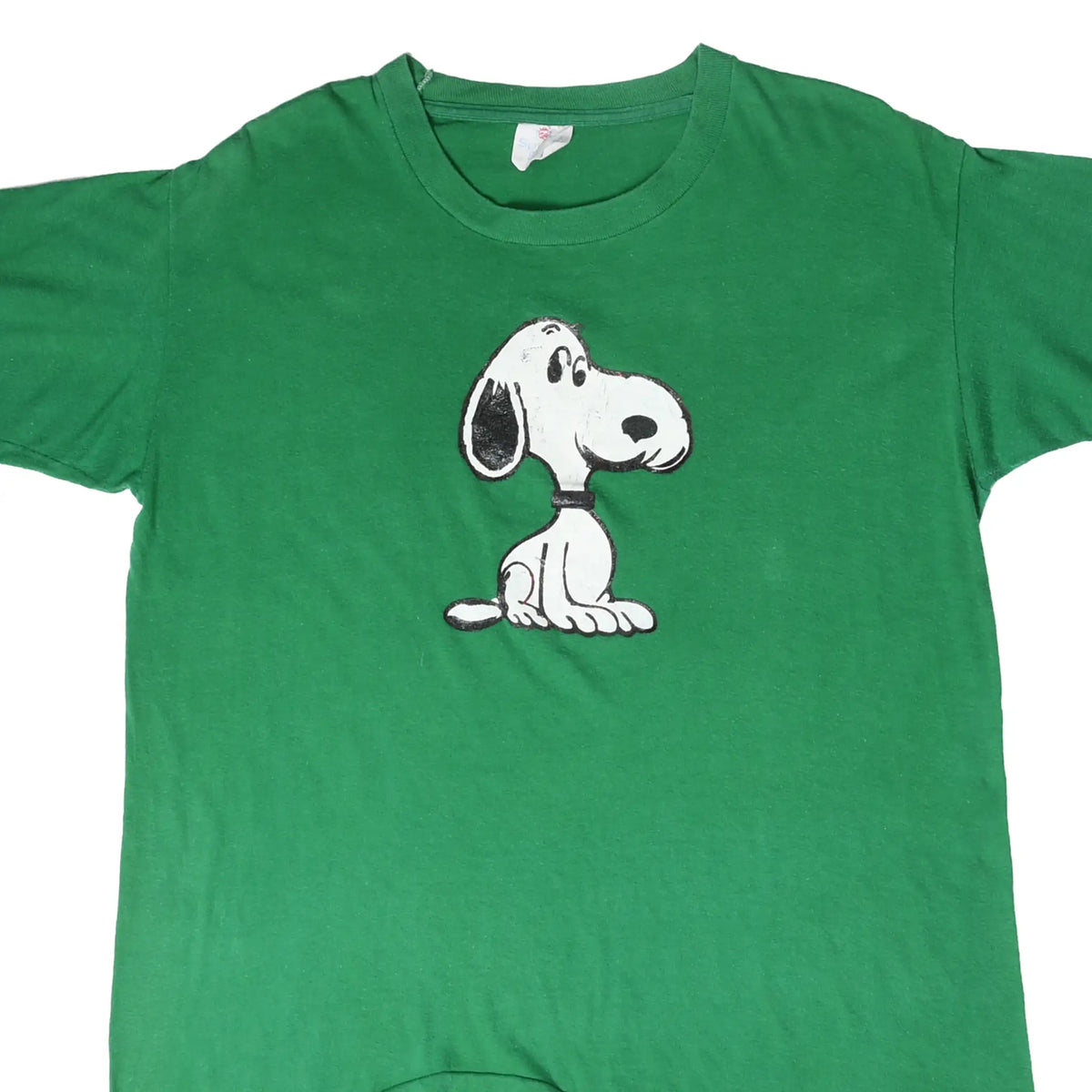 Front of green Peanuts T-shirt with seated Snoopy graphic
