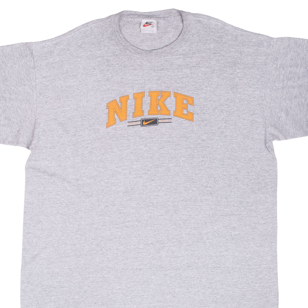 Front of grey Nike T-shirt with orange spellout and Swoosh chest graphic