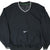 Front of black Nike pullover windbreaker with white center Swoosh and striped V-neck and cuffs