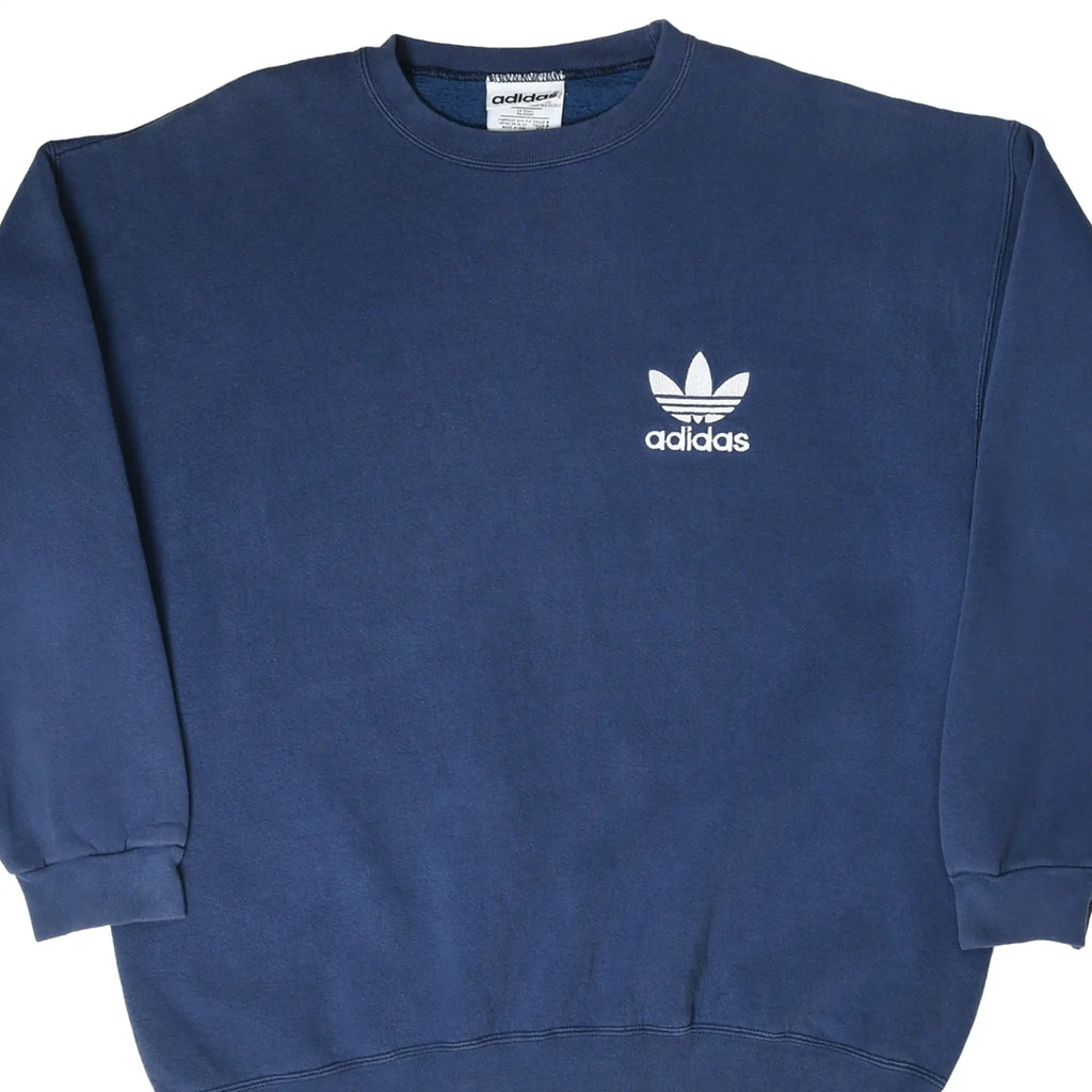 Close front view of navy blue adidas crewneck sweatshirt with white Trefoil chest embroidery