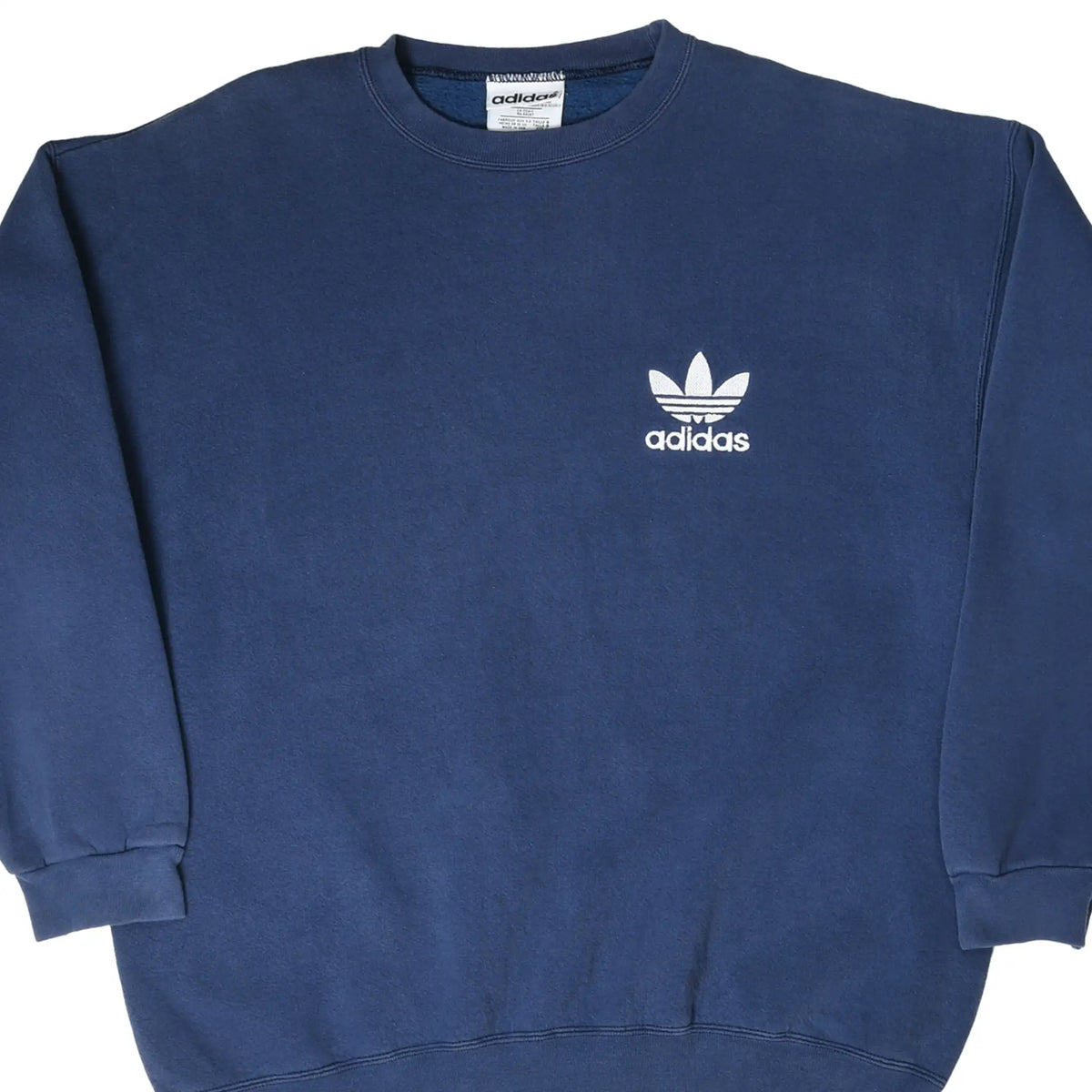 Close front view of navy blue adidas crewneck sweatshirt with white Trefoil chest embroidery