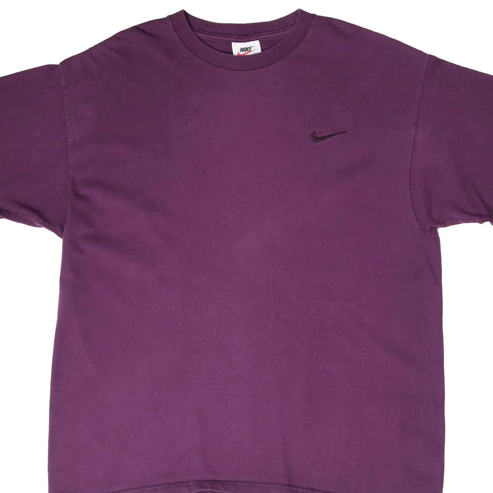 Front detail of purple Nike T-shirt with small dark Swoosh embroidery