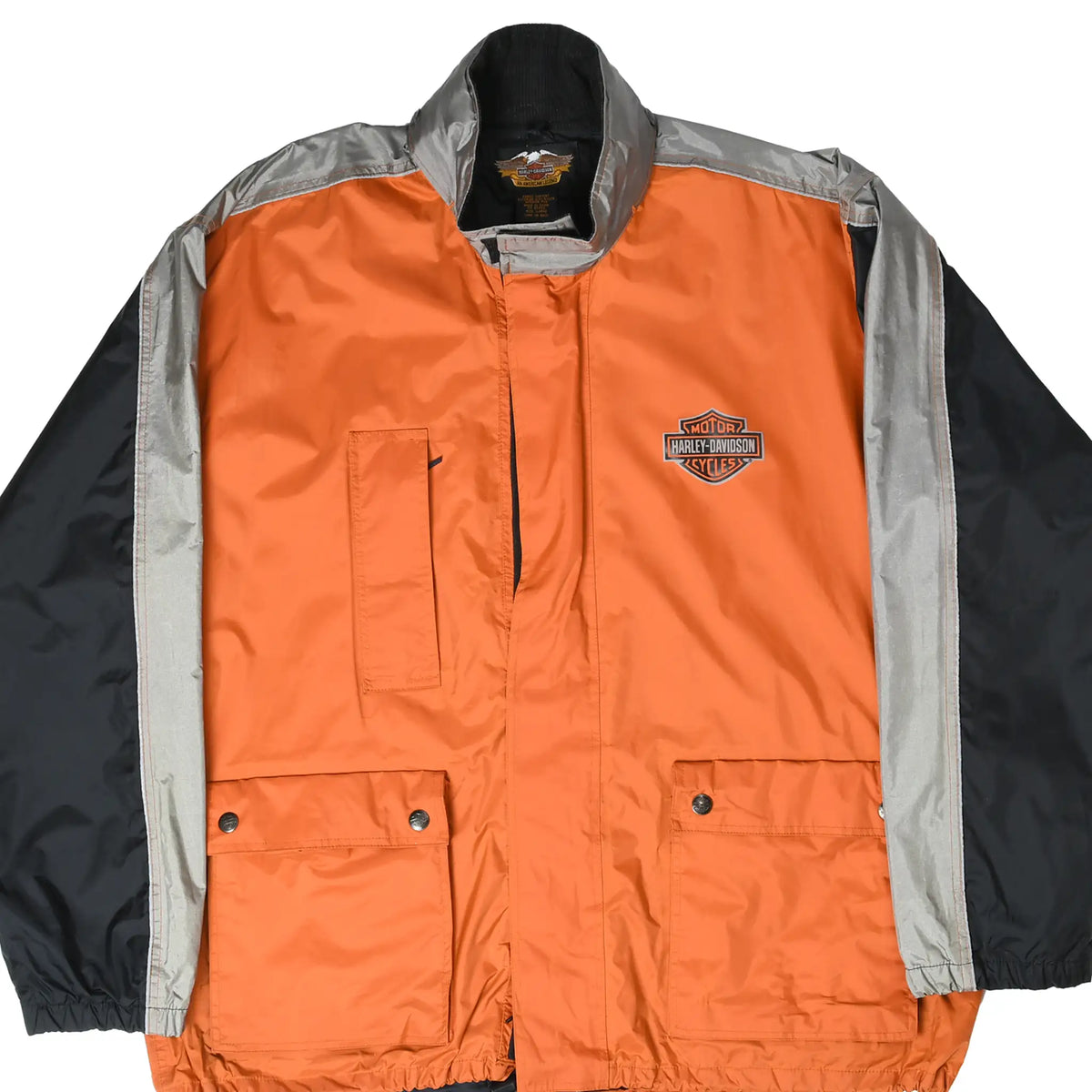 Front of orange Harley-Davidson windbreaker with gray panels, black sleeves, chest logo, and patch pockets