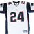 Front close-up of white New England Patriots Reebok Law #24 jersey with navy and red details