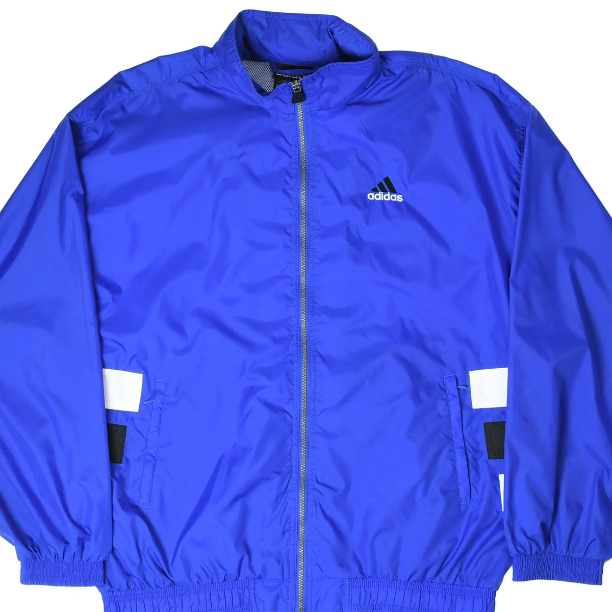 Front close view of royal blue adidas full-zip windbreaker with chest logo and black-and-white pocket accents
