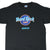 Front of black Hard Rock Cafe Maui T-shirt with blue, pink, and orange logo graphic