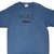 Close front view of blue-grey Nike T-shirt with black Nike Athletics chest print