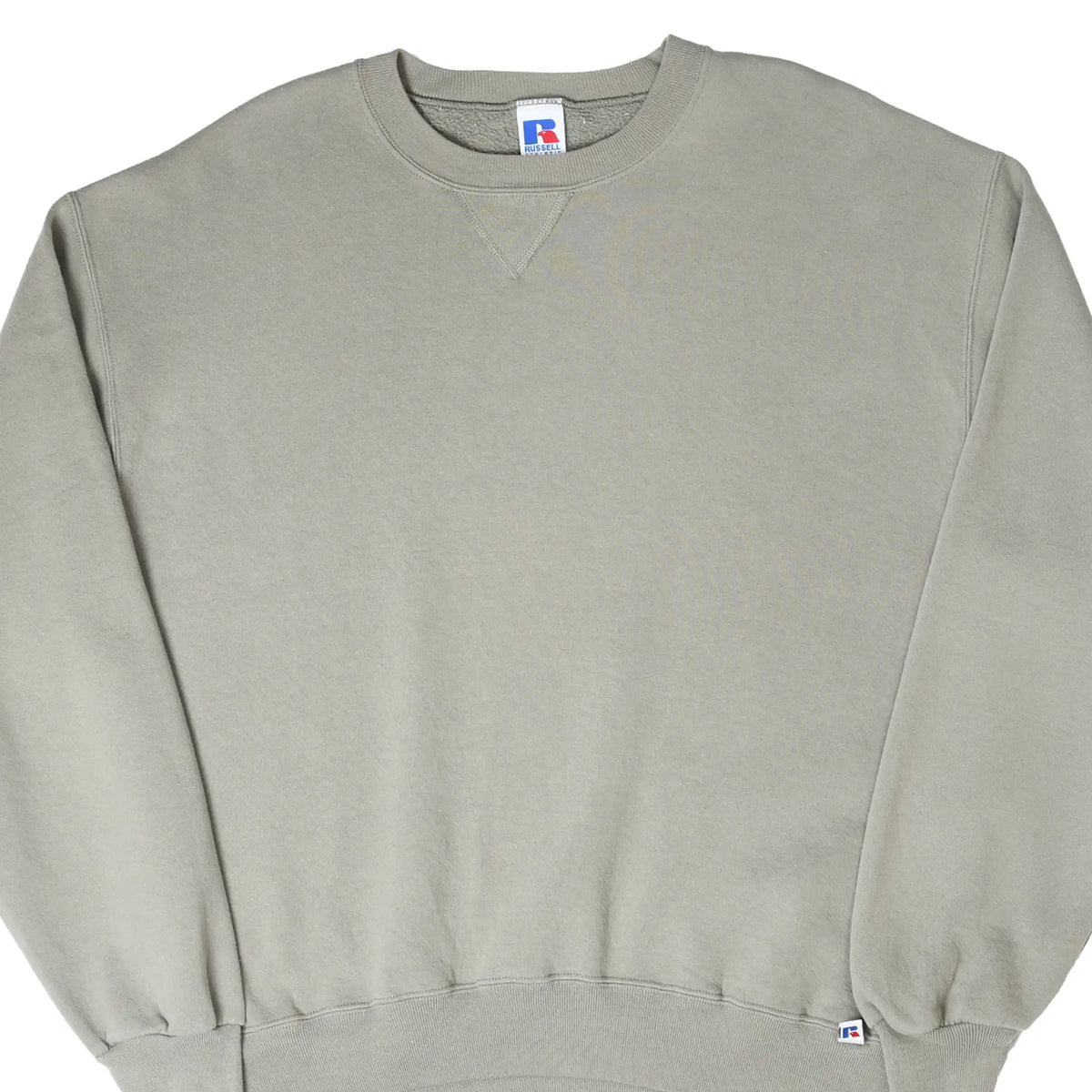 Front close view of blank taupe Russell Athletic crewneck sweatshirt with ribbed trim