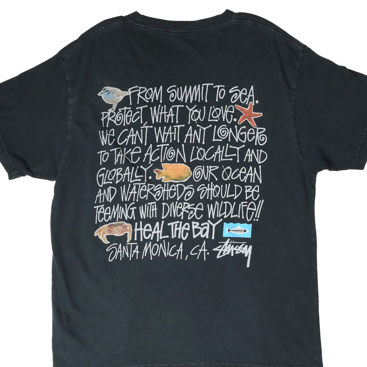 Back of black Stüssy T-shirt with Heal the Bay Santa Monica ocean wildlife graphic and handwritten text