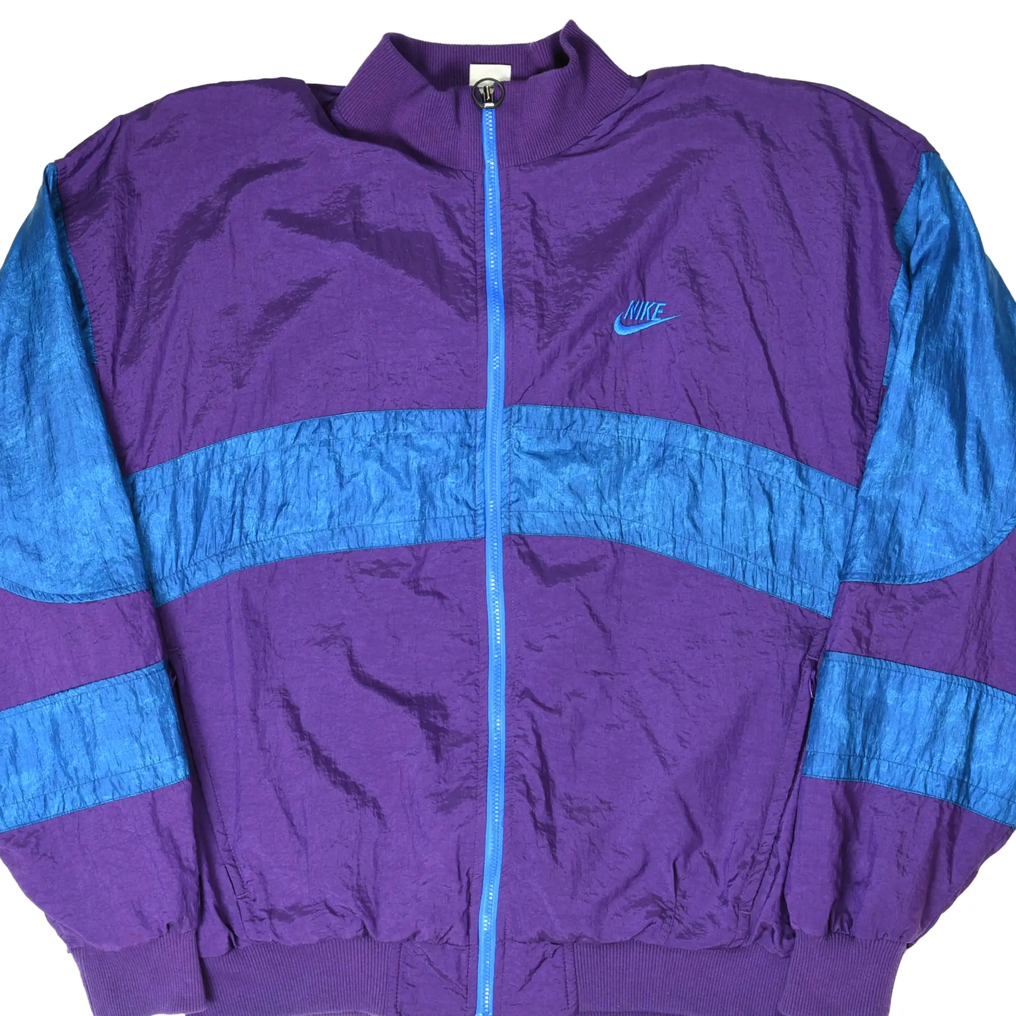 Front of purple and blue Nike International zip-up windbreaker jacket