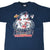 Front of navy Cleveland Indians T-shirt with 1997 American League Champions player graphic