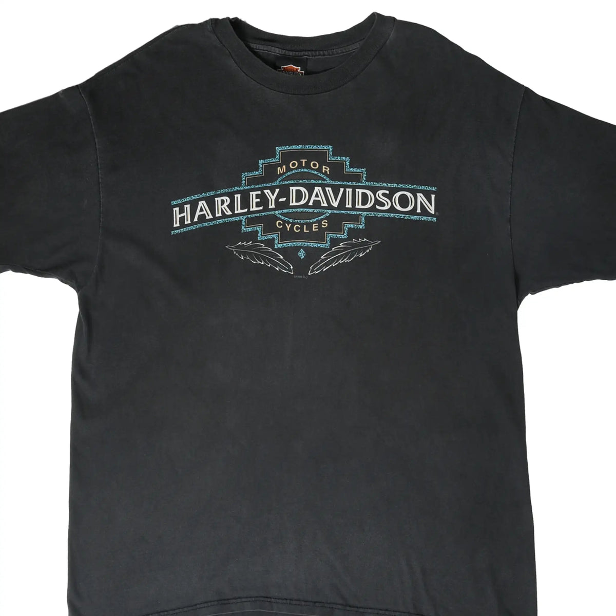 Front of black Harley-Davidson T-shirt with turquoise, white, and tan Motor Cycles logo