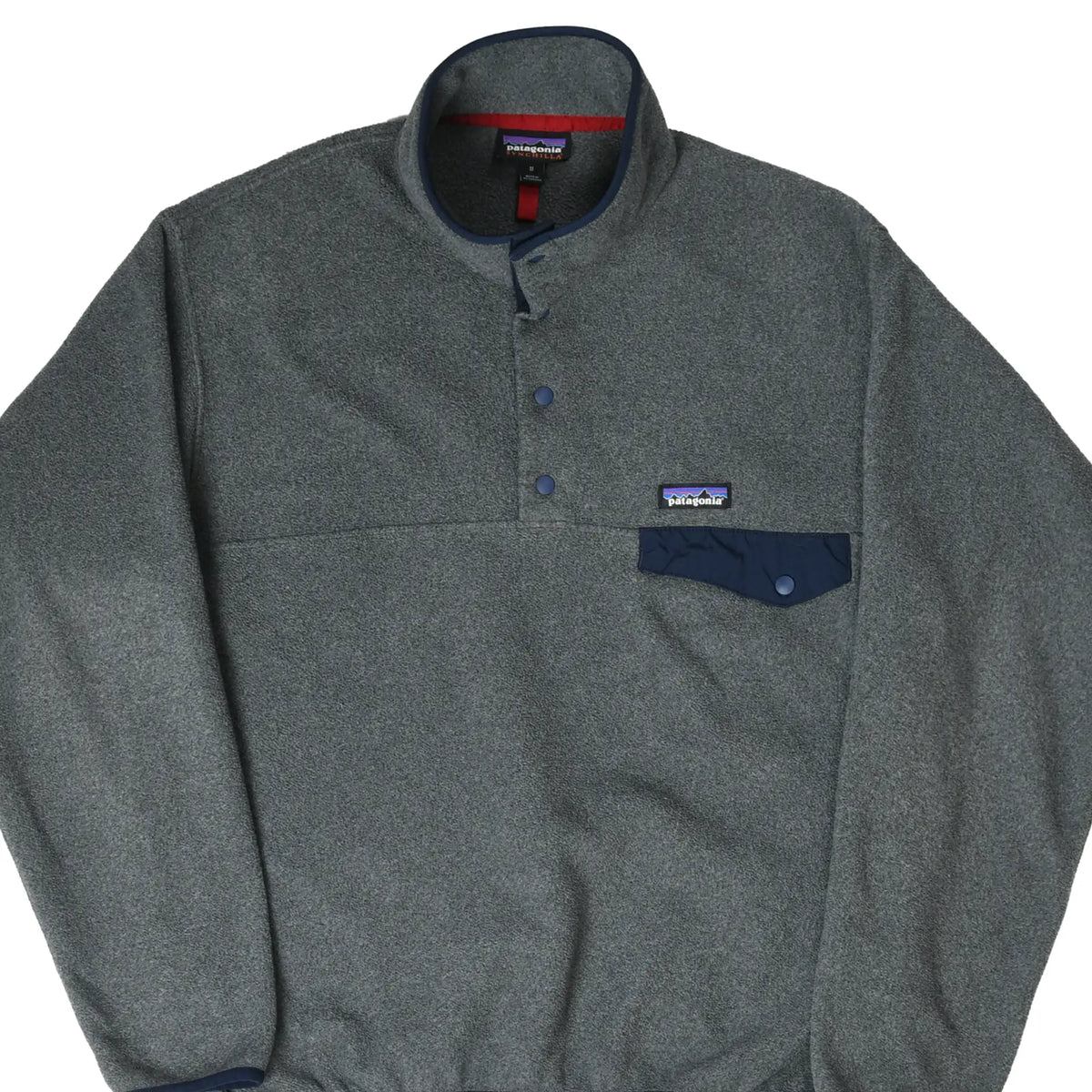 Front of grey Patagonia Snap-T Synchilla fleece pullover with navy snap placket and chest pocket