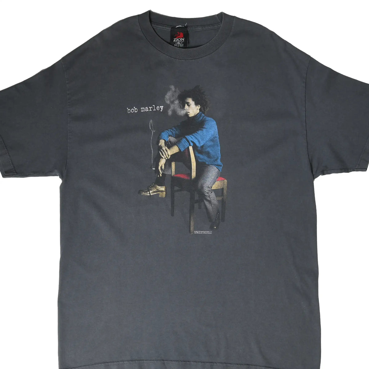 Front of grey Bob Marley T-shirt with seated portrait graphic and small white name text