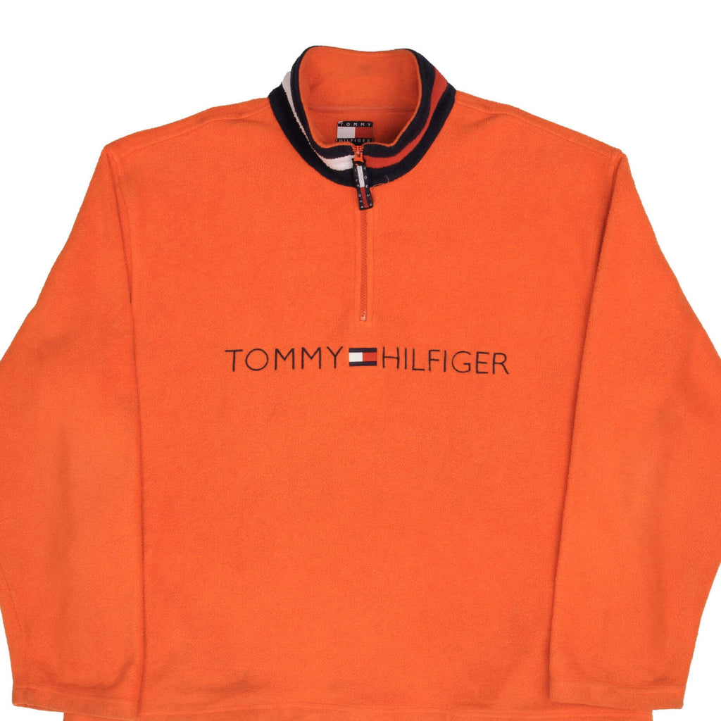 Front of orange Tommy Hilfiger fleece quarter-zip pullover with embroidered chest logo