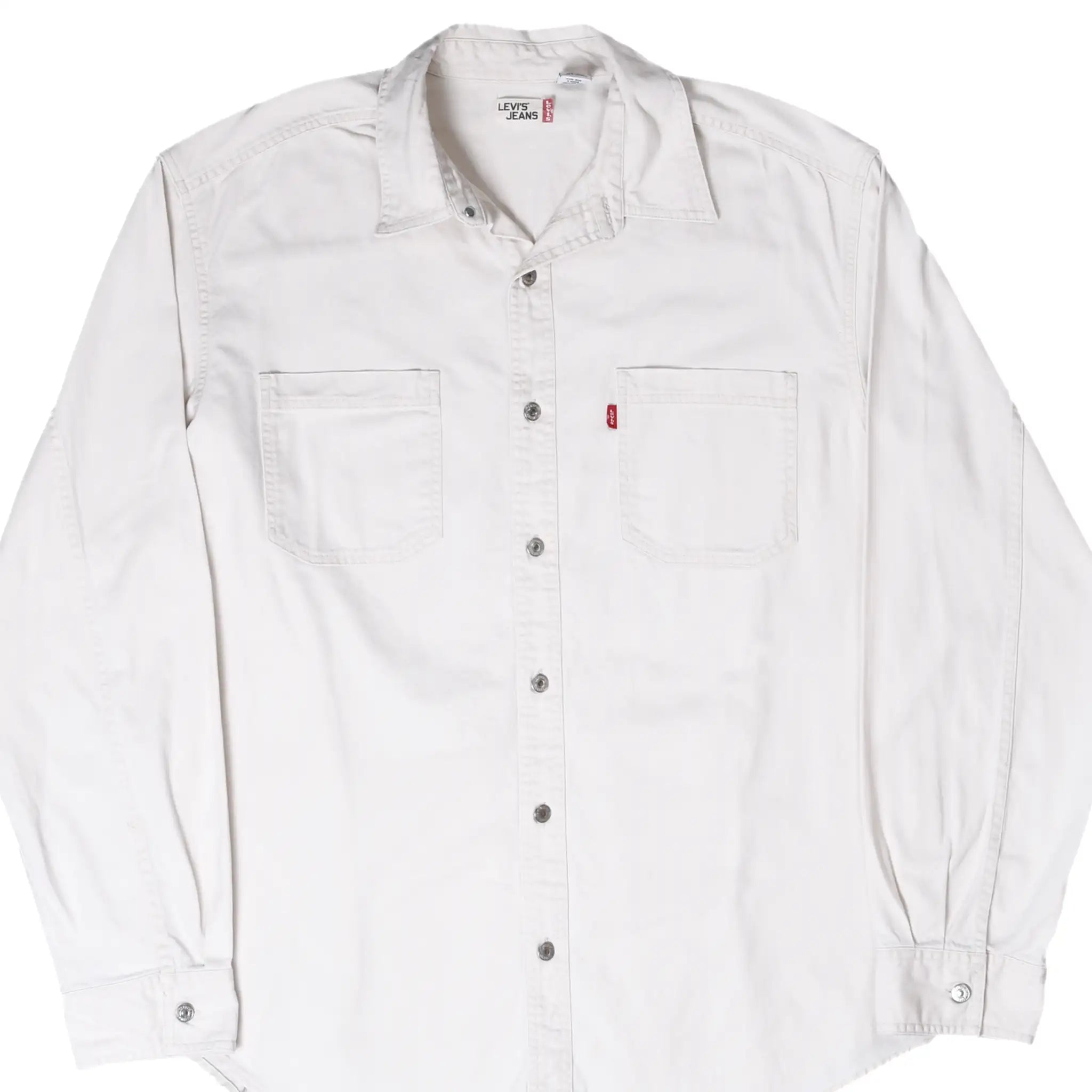 Front of white Levi's denim shirt with long sleeves, snap buttons, two chest pockets, and red tab